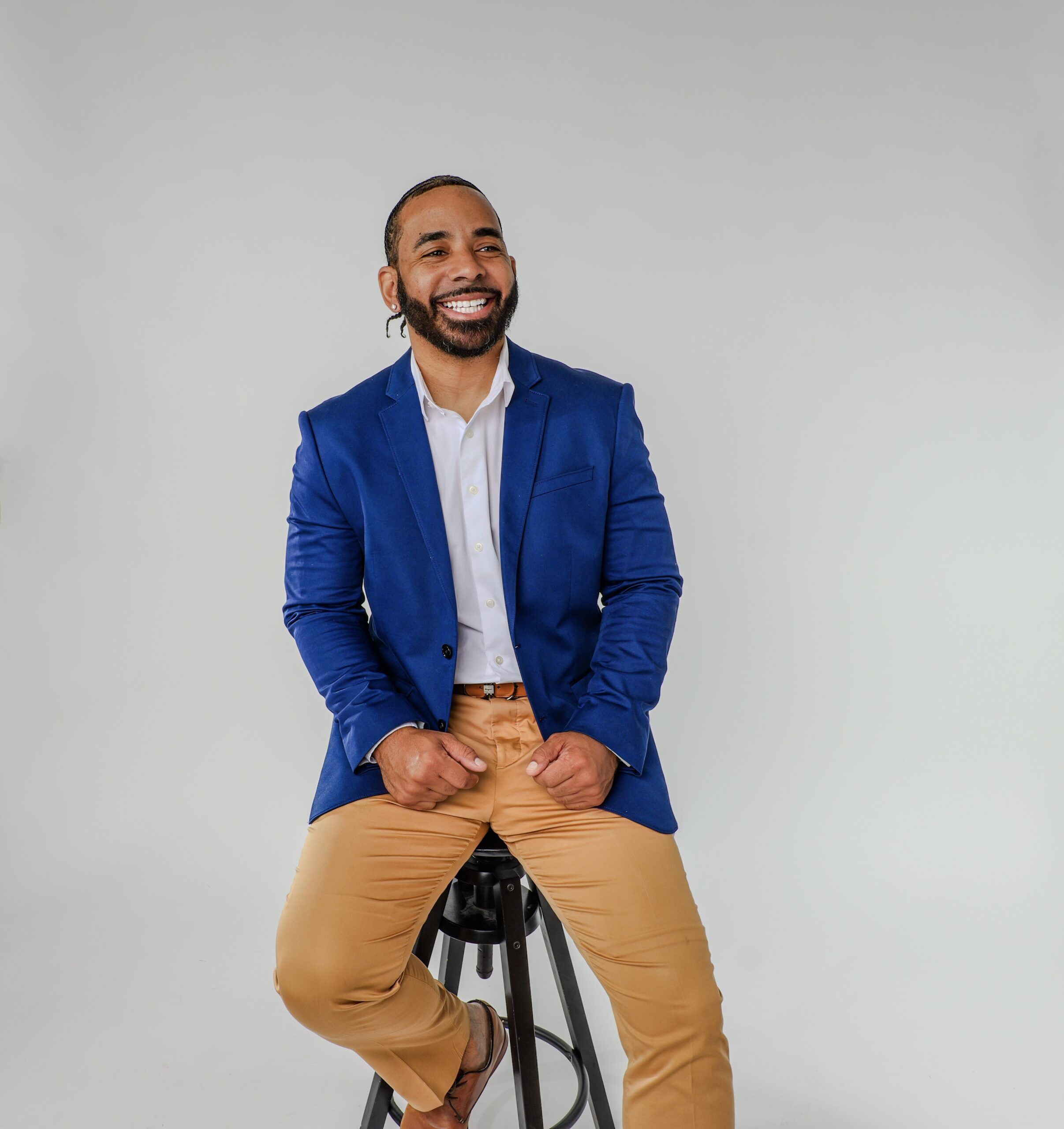 A Man Sitting On A Stool